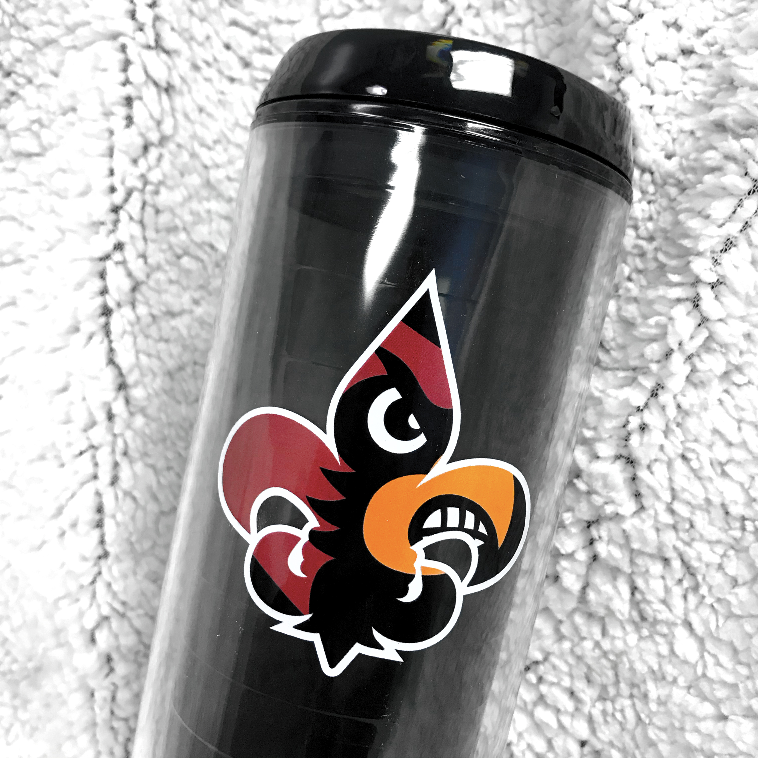 University of Louisville tumbler with cardinal logo.